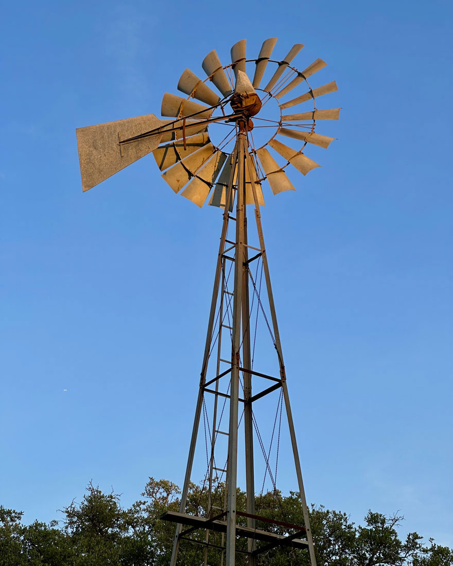 Historic windmill against clear blue sky at Peacock Preserve